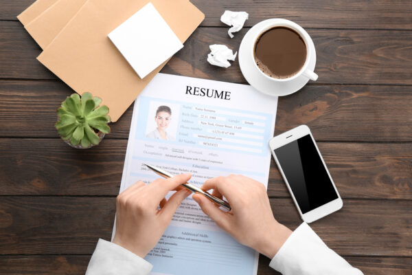 Woman with resume form at table. Job interview concept