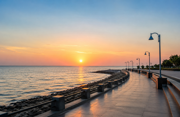 Scenic view of Ghogha Beach in Bhavnagar with a clean seaside promenade and calm sea representing Resume Writing Services Bhavnagar.