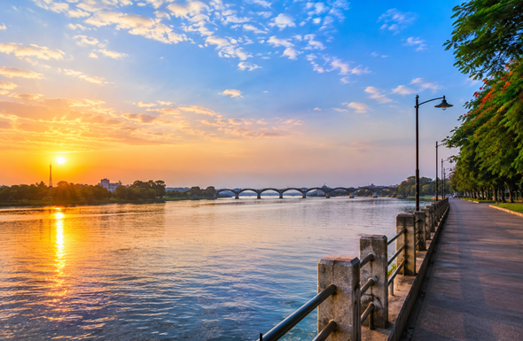 Scenic Krishna River Riverfront in Sangli with a clean riverside promenade, calm water, bridge, and beautiful sunset representing Resume Writing Services Sangli.
