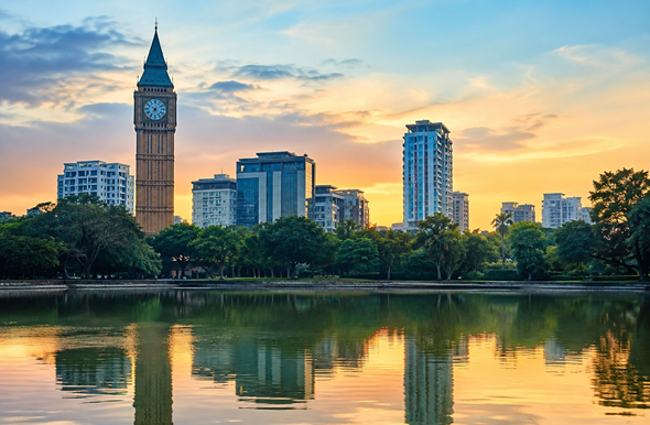 Scenic modern urban view of South Dumdum, Kolkata with greenery, buildings, and a clock tower resume writing