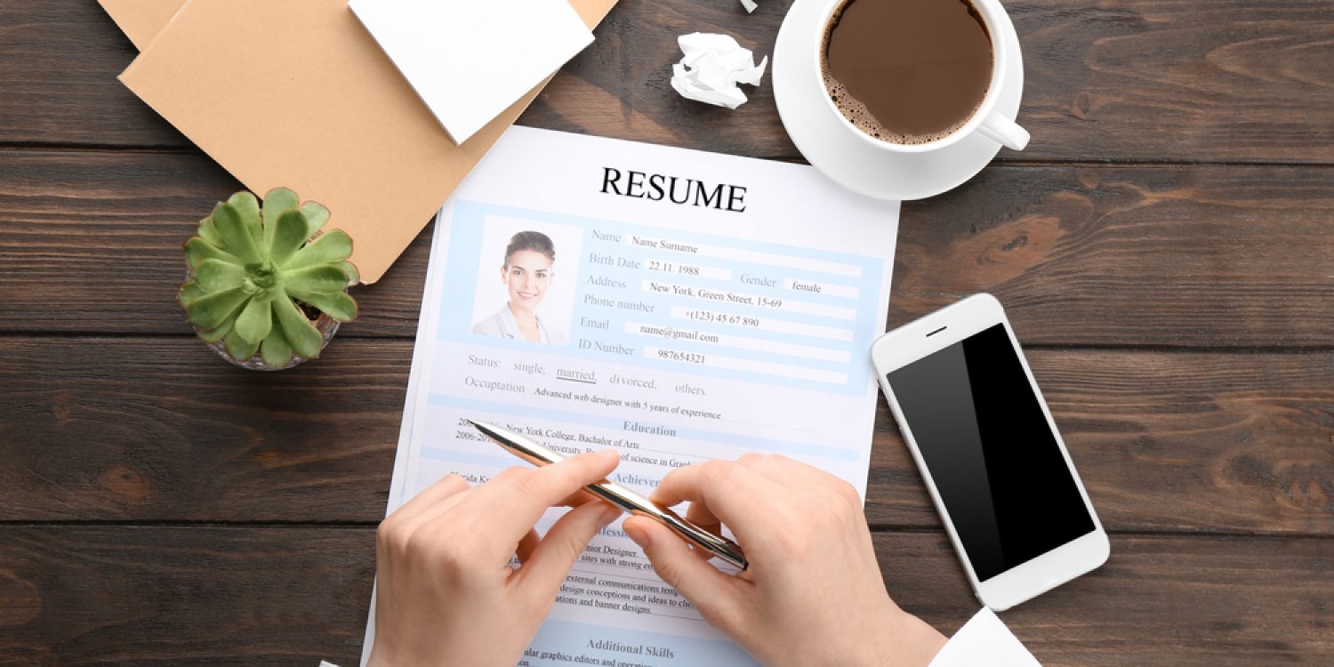 Woman with resume form at table. Job interview concept